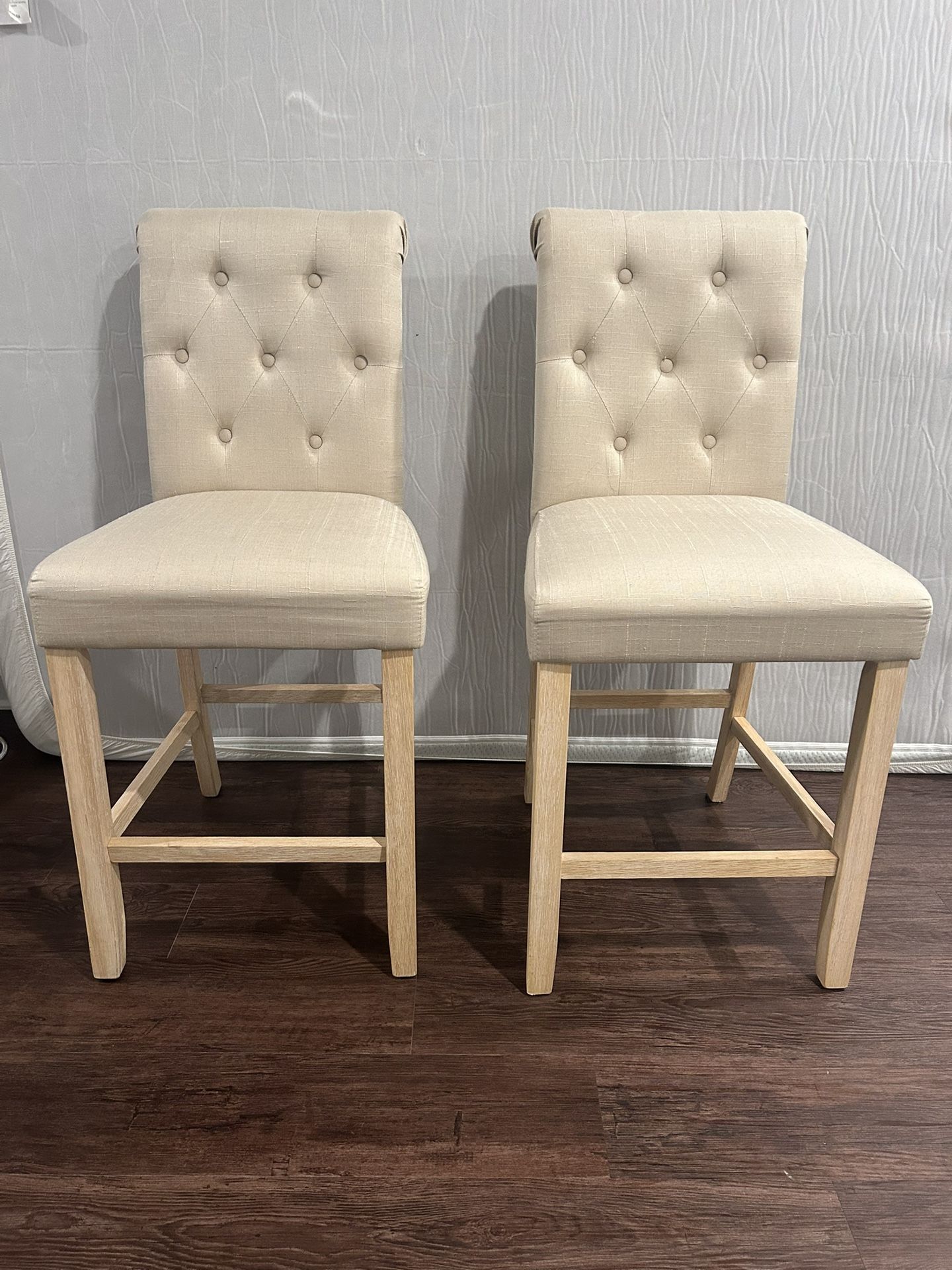 Two upholstered counter top stools