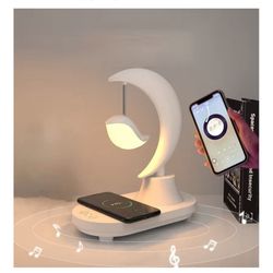 3-in-1 moon lamp with built-in Bluetooth speaker and wireless phone charging.