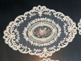 Set of six embroidered doilies