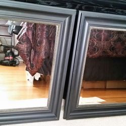 Pair of black wood and beveled glass mirrors