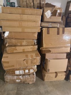 17 boxes containing a mix of wooden shoe racks, home decor, and general household goods.