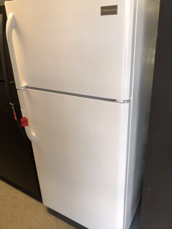Used Frigidaire 16 cu ft top and bottom fridge. 1 year warranty