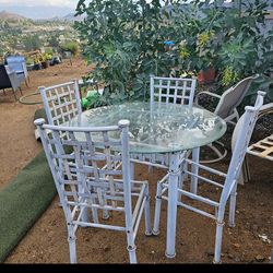Patio Glass Table And Chairs ( 4 Chairs Need a new seats)