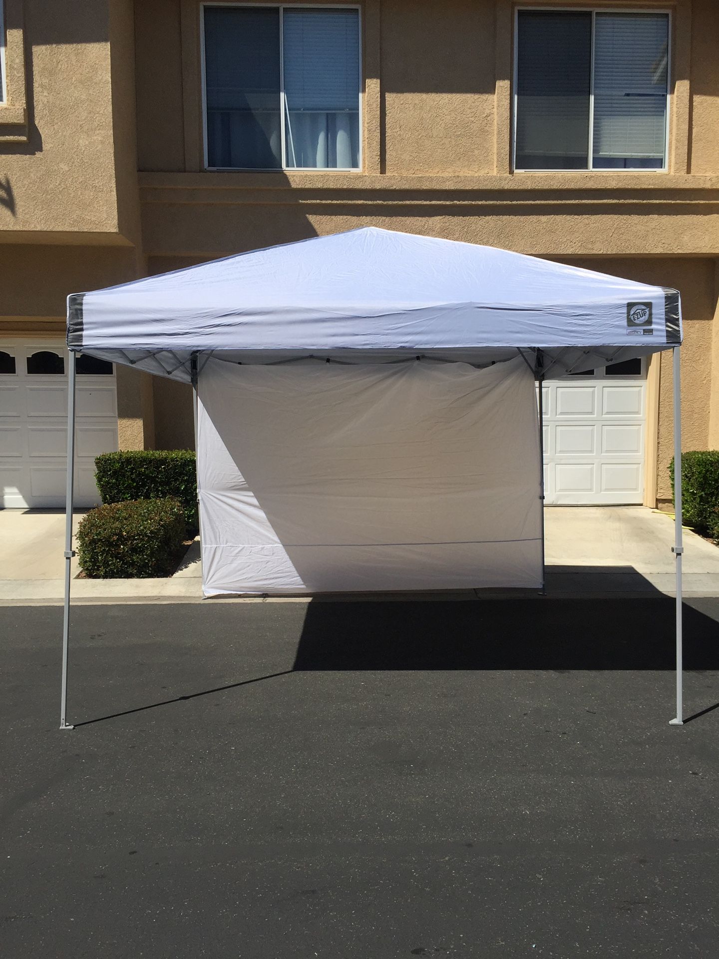 Ez Up Brand Canopy 10x10 Straight Leg, Regency Model, Included Carrying Bag, 4 Sand Weight Bags and Side Wall.