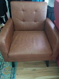 Brown leather chair very euro chic looking