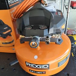 RIDGID6 Gal.​ 150 PSI Portable Electric Oil-​Free Jobsite Pancake Air Compressor with Dual Pressure Gauges and 2-​Quick Couplers