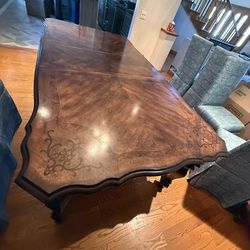 65in Dinning Table Comes with two 18 inch leaves Total length with leaves is 101in. Solid Dark Wood