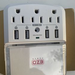 Power surge protector wall mount plate that features three AC outlets and four USB charging ports.  $10