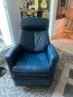 Blue leather power rocker swivel recliner