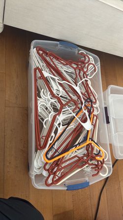 Plastic hangers, mostly white