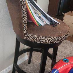 2 brown leopard print bar stools