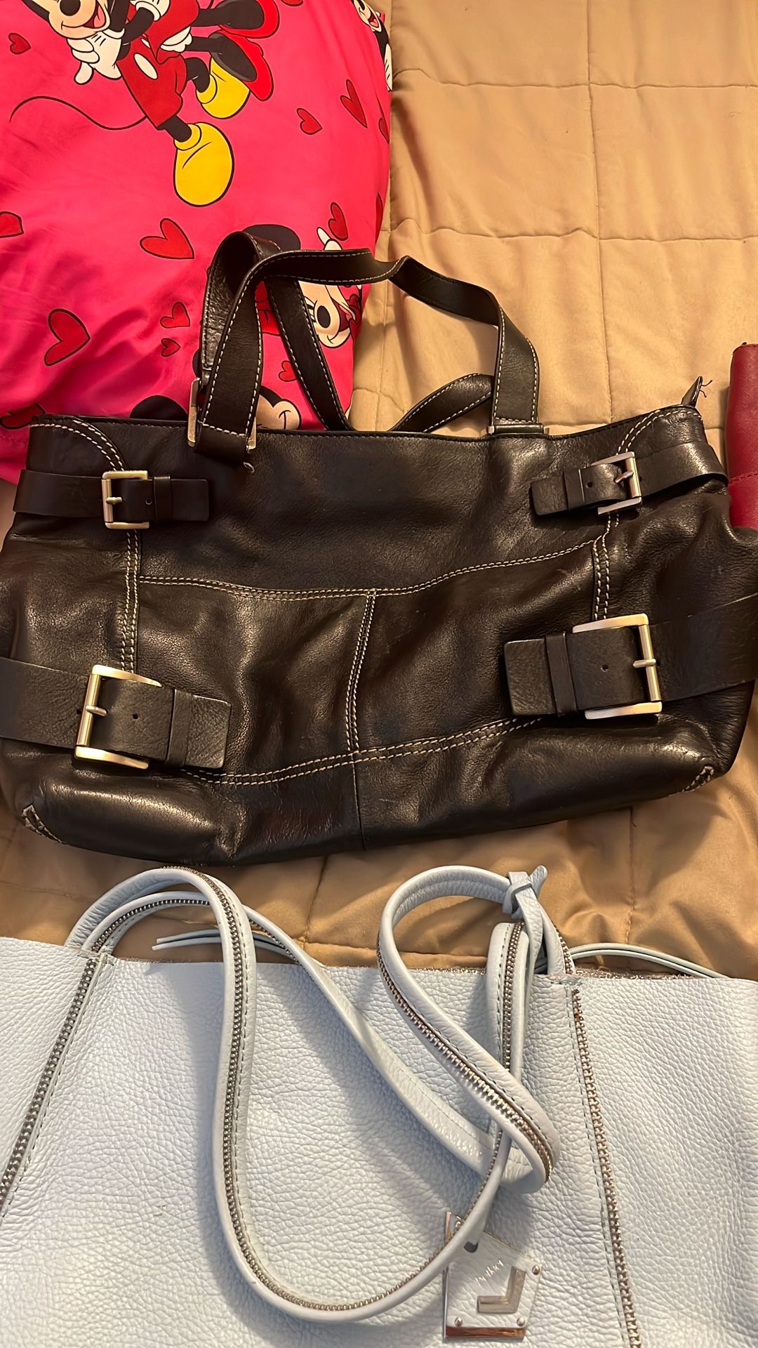 Handbags through Michael Kors broke gear and the black one is Michael Kors