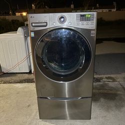 LG front load washer on a pedestal.