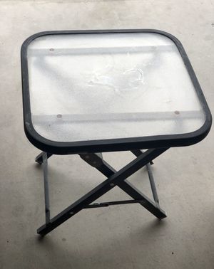 Photo Portable glass and metal side table. Great for outdoors, camping or RV.