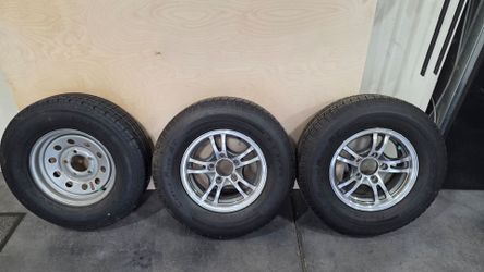 3 trailer wheels and tires, 2 aluminum rims and 1 spare