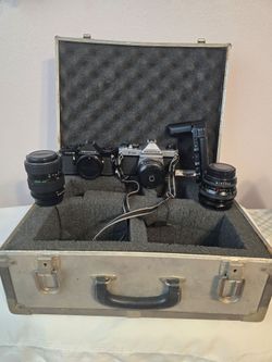 Pentax cameras, with two additional lenses