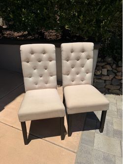 Two Solid Tufted Beige Dining Chairs