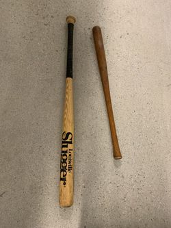 Lousville Slugger bat and anothernicely finished baseball bat