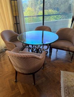 Stunning vintage glass table and game chairs