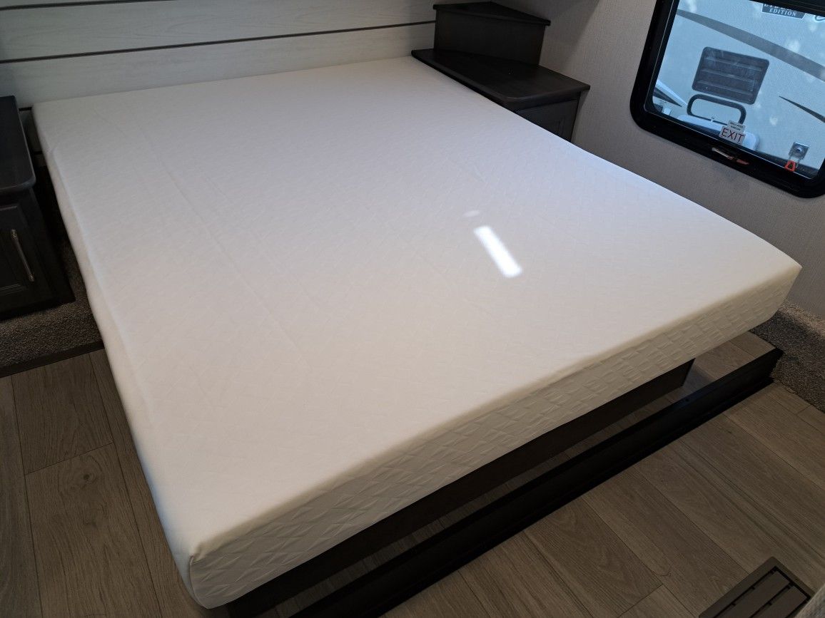 Brand new, unused Queen size mattress, bedspread and platform from an RV.