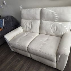White leather dual recliner love seat