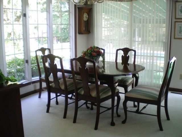 Cherry dinning table and china hutch (lighted) chairs and also have matching tea server and silver cabinet