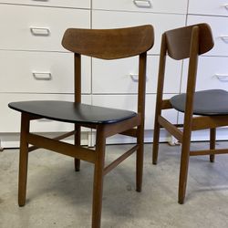 Set Of two Mid Century Modern wooden Dining Chairs with black tapestry.