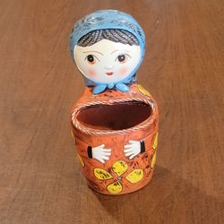 Vintage 1960s papier-mâché Babushka doll wall pocket or holder Pride 
Creations Japan.
It is 8" tall. The material is papier-mâché, meaning it cannot 