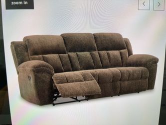 Reclining sofa like new . Extremely soft fabric comfortable Ashley FROHN model.