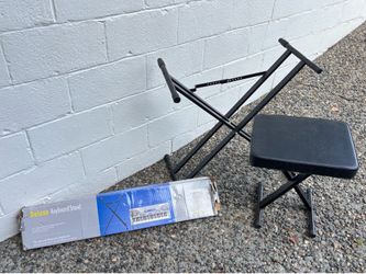 Casio deluxe keyboard stand. Still wrapped inside box. We were sent two. Also a second keyboard stand (used) and piano stool.