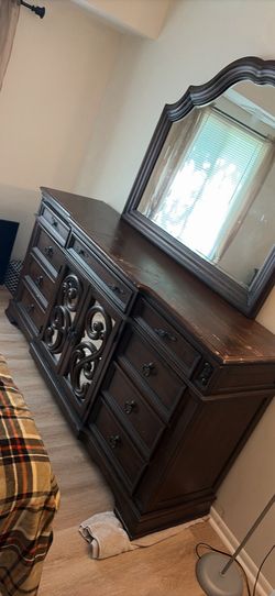 Ornate dark wood dresser with mirror