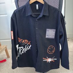 Men’s black long sleeve button-up shirt with bold streetwear graphic prints. Displayed item. Never wear.   Features: 	•	All-over graphic print on fron