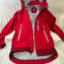 Mountain Hardwear Mens Multi sport Parka/ Rain Jacket Red size Medium. Missing eyelet left side hood