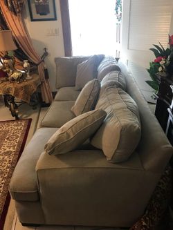 Feathered light grey sofa