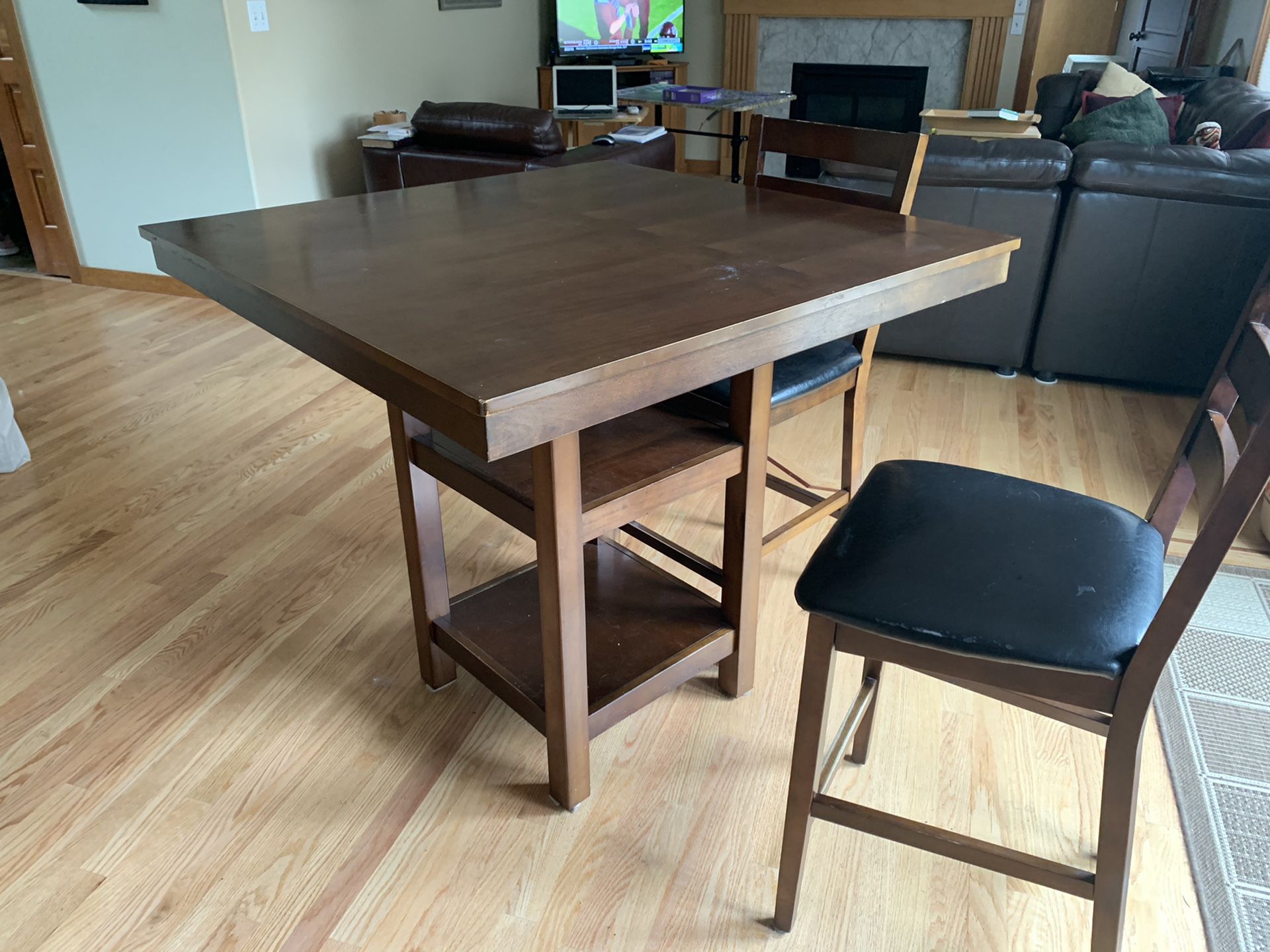 Kitchen table set. Gathering table and 4 chairs. Table top could use a refinish.