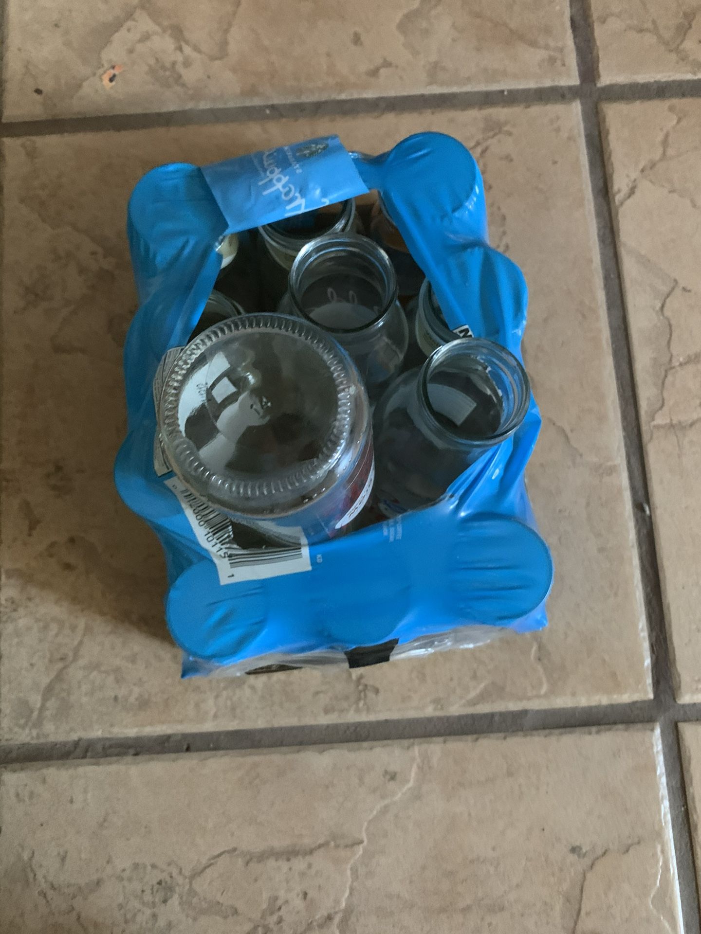 Free. 12 Starbucks empty jars with lids for arts and crafts.