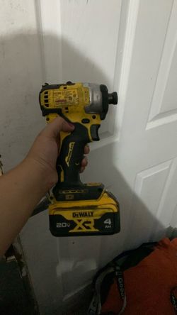 used DEWALT ATOMIC Compact Series 20V MAX Brushless 1/4-inch Impact Driver (Model DCF809).