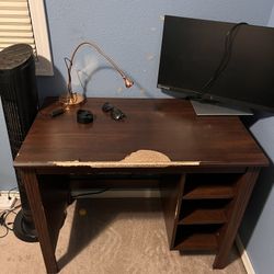 Brown IKEA table for computer and office use, 30” By 36” By 24”