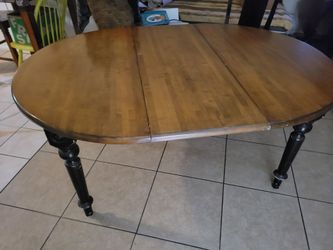 solid wood Heavy duty table and 2 matching chairs.