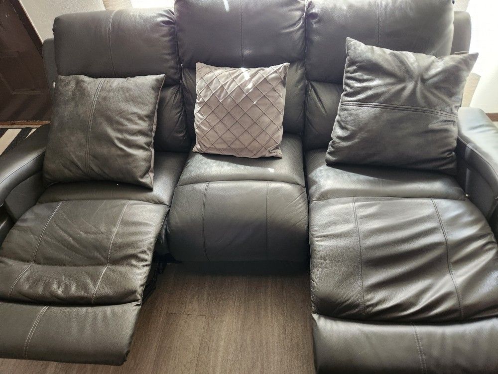 Two Reclining Gray Leather Sofas