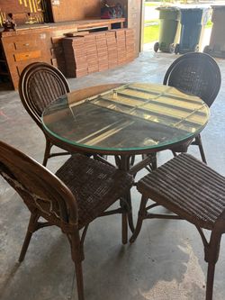 Rattan table and 4 chairs