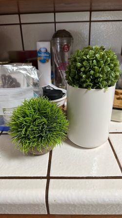 tabletop artificial bygrass plant in a rounded cement pot featuring vibrant, spiky green faux foliage cc