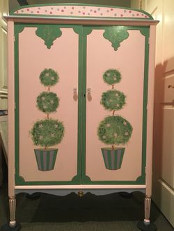 Beautiful hand painted small armoire.