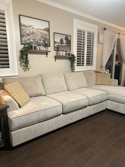 Mathis Brothers Light Beige Sectional Sofa with Right-Facing Chaise and Matching Loveseat