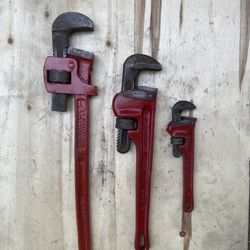 Three pipe wrenches