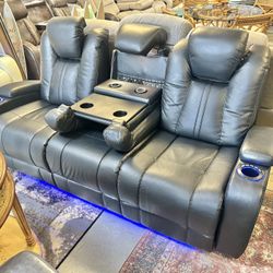 Like New Leather Electric Dual Reclining Couch With Electric Headrests And Dual USB And Wireless Charging Stations And LED Lighting 
