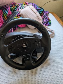 Thrust master driver's wheel attachment