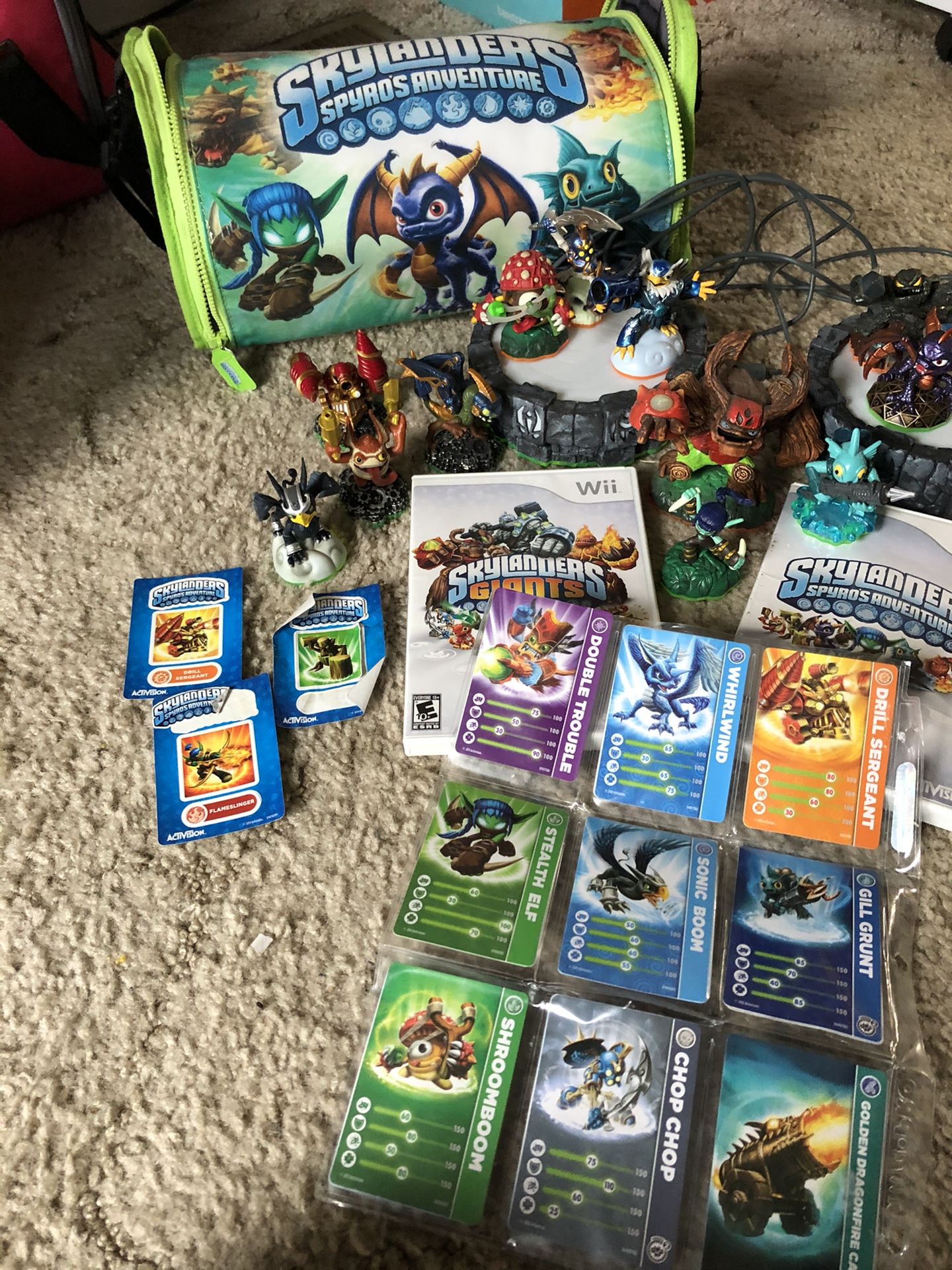 Skylander Wii games and 16 characters with carrying case