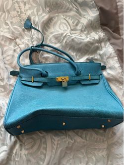 Blue leather handbag with gold