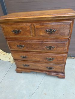 Dresser Wood Small width 38 41 hight it has wheels Vintage